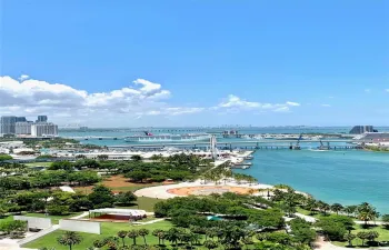Unobstructed water view from balcony, living area, and master bedroom.