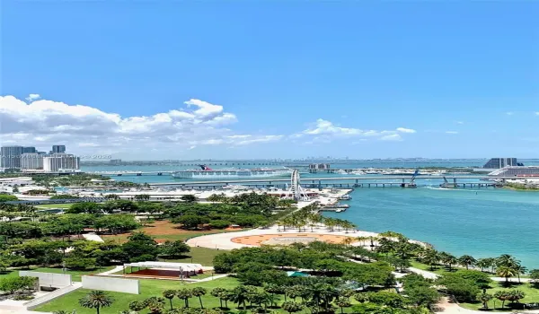 Unobstructed water view from balcony, living area, and master bedroom.