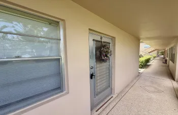 Desirable Location! First Floor CORNER With Updates to Flooring, Kitchen & Baths!