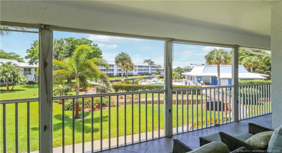 Enjoy true Florida waterfront living from the oversized screened lanai overlooking manicured grounds, canal views, and resort-style amenities just moments from the river.