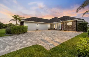 Front of home with paver drive.