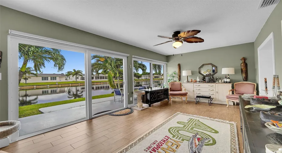 Enclosed sunroom facing the canal. All sliding doors impact rated