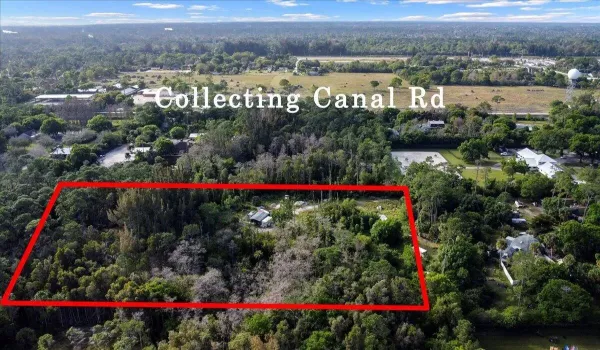 Wide aerial view highlighting the approximate property boundaries and proximity to Collecting Canal Road.