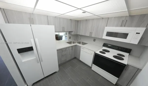 Brand new refrigerator. Room for small breakfast table.