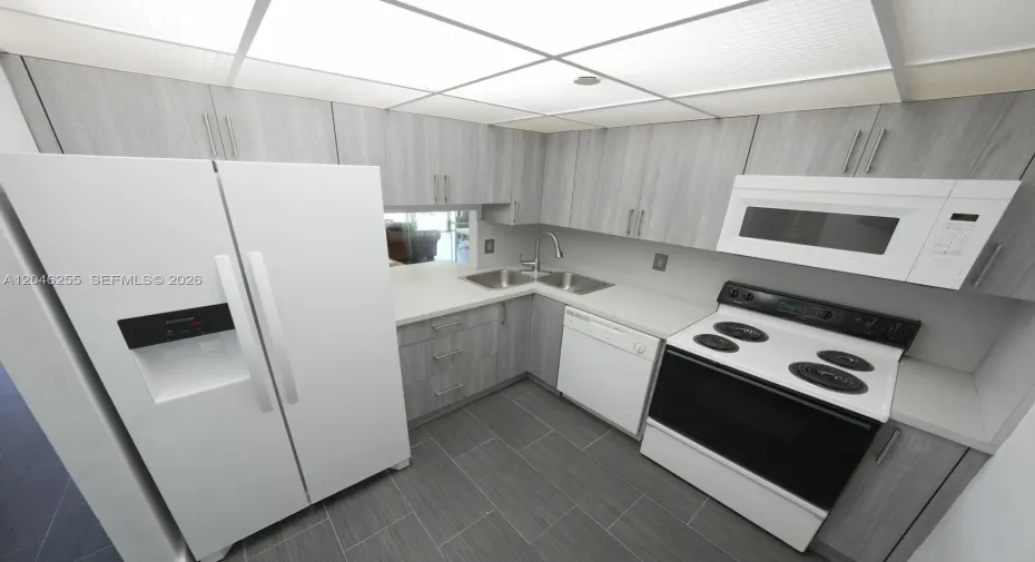 Brand new refrigerator. Room for small breakfast table.