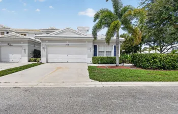 Attached garage with a paved driveway