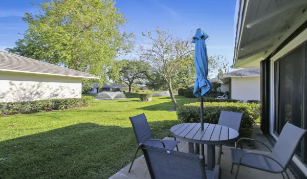 Back patio with golf and fountain views.