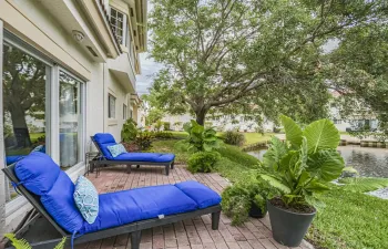 Paver porch overlooking pond w/ fountain