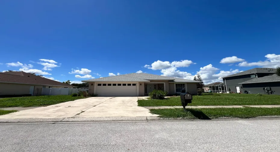 Attached two-car garage with panel windows