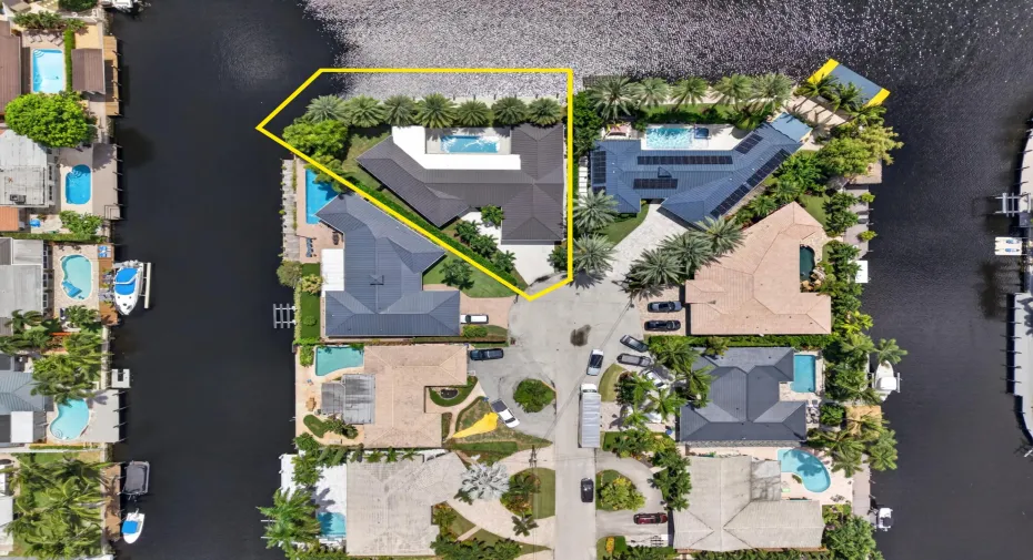 Aerial view of home on gorgeous point lot outlined in yellow