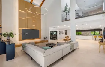 Every detail reflects thoughtful craftsmanship, from the custom millwork and integrated media wall to the dramatic ceiling heights that define the home’s architectural character.