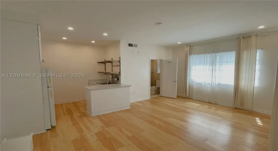 Living room, kitchen, and dining area