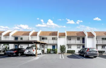 COVERED ASSIGNED PARKING STEPS FROM FRONT DOOR