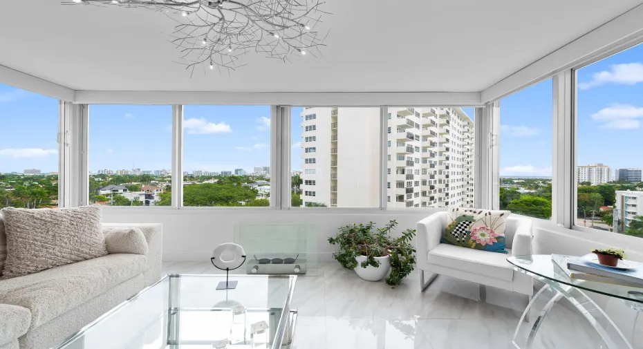 Sunroom with views of the city and ocean