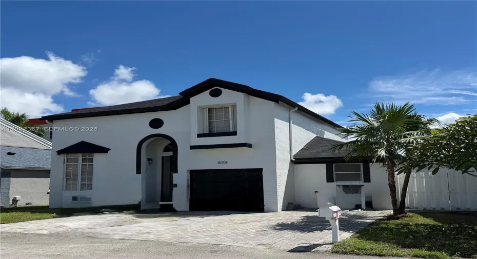 Front of Property with 1 car garage.