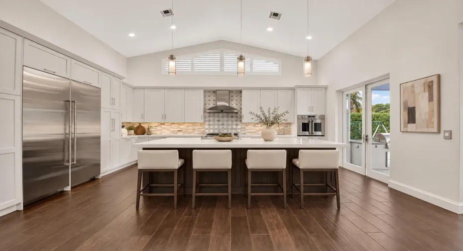 Refined neutral kitchen with ivory stool