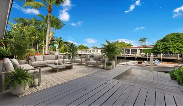 Virtually Staged. Waterfront property featuring a private dock and lush tropical landscaping
