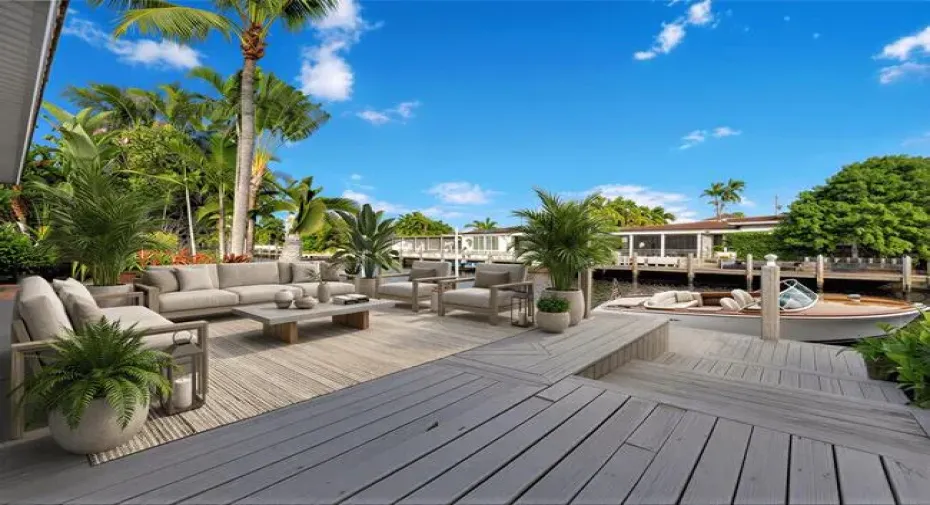 Virtually Staged. Waterfront property featuring a private dock and lush tropical landscaping