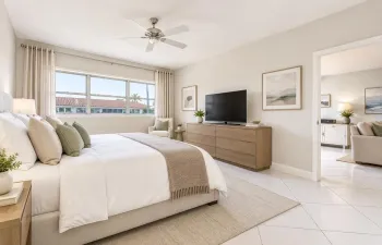 Recessed lighting, ceiling fan, expansive window, wood-finish dresser, and white tile flooring