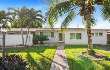 Welcoming front exterior of this Westchester rental with mature tropical landscaping.
