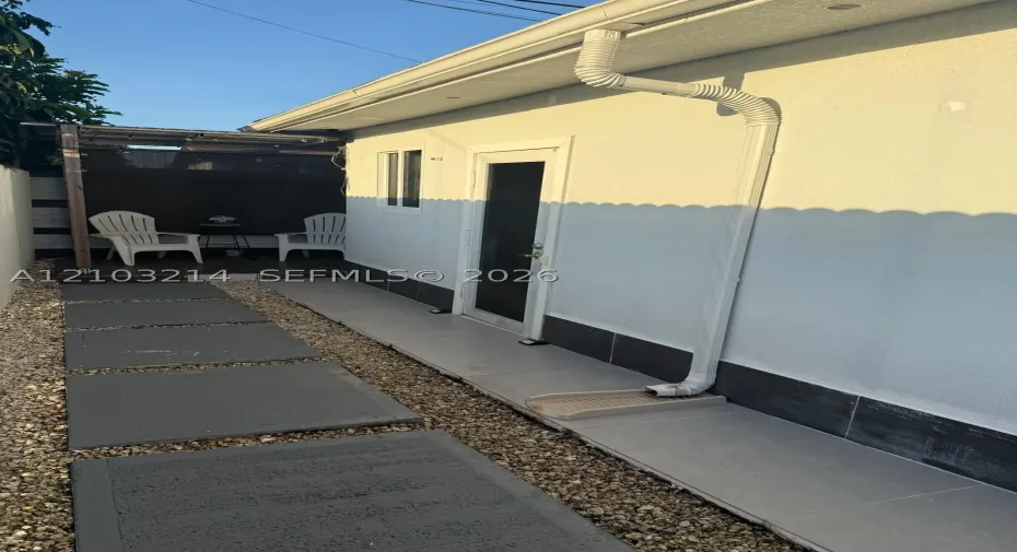 private outdoor entry with a cozy patio area