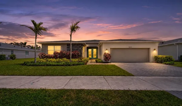 Modern exterior with stucco and stone veneer accents