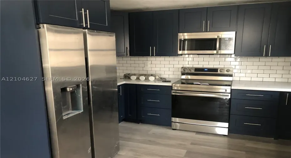 Open layout with microwave, oven/stove
