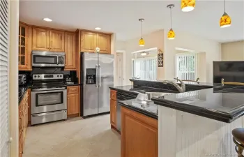 One of a kind kitchen island with sink and dishwasher attached allowing for easy entertaining.