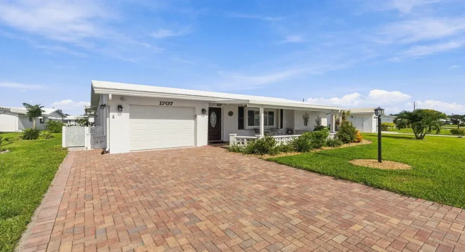 Beautiful curb appeal with double paver driveway