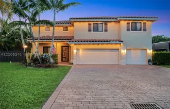 Two-story stucco exterior with a tile roof