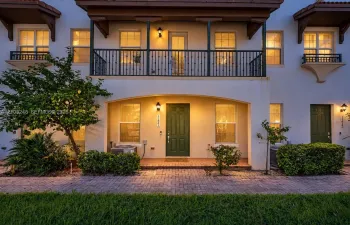 Stucco exterior with a tiled roof accent -Virtual Twilight