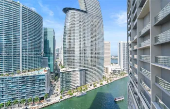Waterfront property with multiple high-rise buildings and a prominent waterway