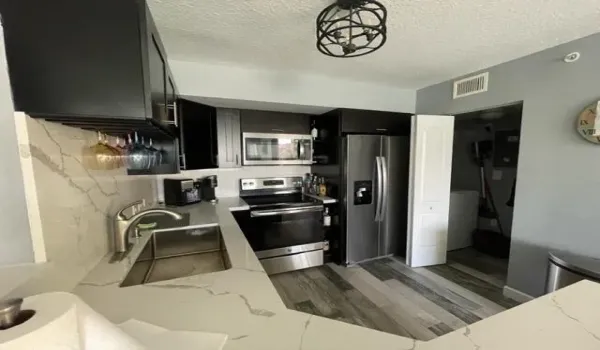 3 Bed 2 Bath Corner unit located on the 2nd floor with water views from bedrooms & Living area-Community Inspection completed -Buildings exterior renovated-roadways-landscaping-