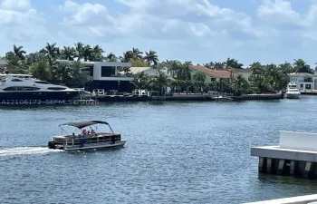 Waterfront property featuring a concrete bulkhead and dock