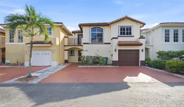 Stucco exterior with a tile roof