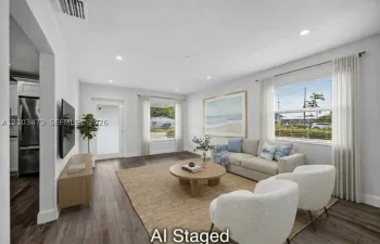 Recessed lighting, wood-finish flooring, white walls, and white window blinds