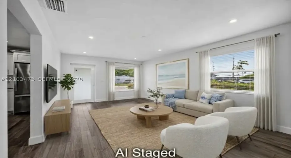 Recessed lighting, wood-finish flooring, white walls, and white window blinds