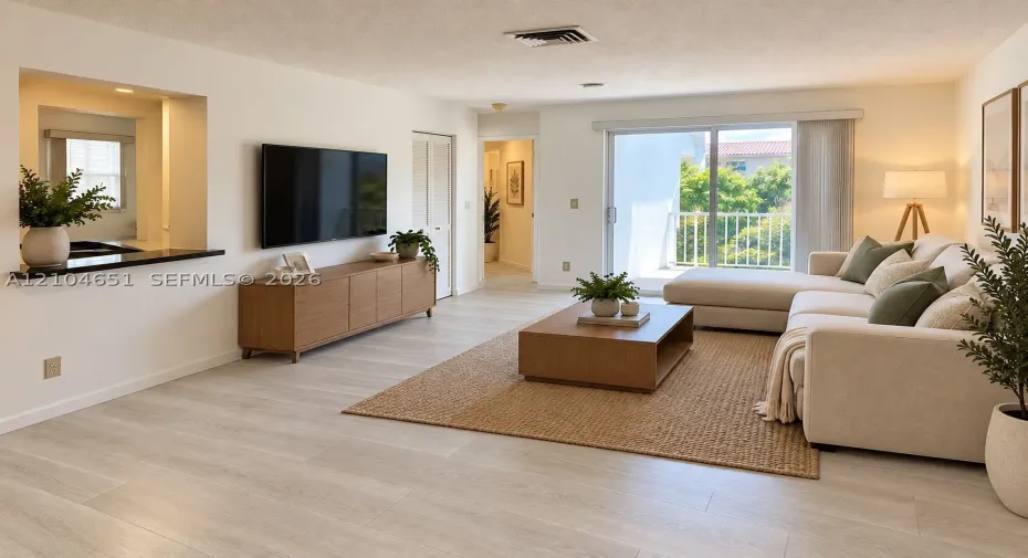 Living area featuring wood-finish flooring, a kitchen pass-through with a dark countertop, and sliding glass doors with balcony access