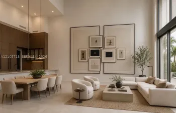 Double-height ceilings, floor-to-ceiling windows, custom built-in wall paneling, full-height dark wood-finish cabinetry, and neutral stone-finish flooring