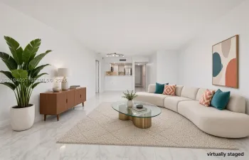 Open-concept living area featuring light-toned stone-pattern flooring, neutral wall finishes, and a breakfast bar