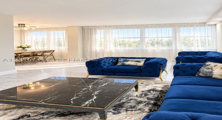 Polished stone-finish flooring, floor-to-ceiling windows, and recessed ceiling lighting