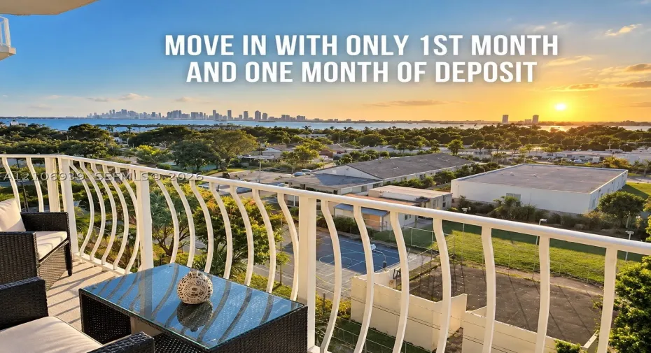 Private balcony featuring a white metal railing and an expansive horizon line encompassing a coastal waterway and distant skyline