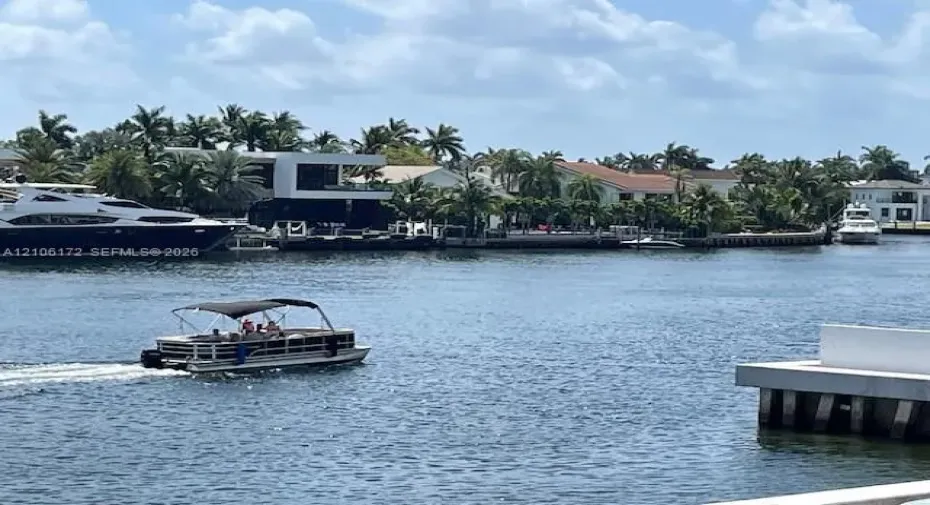 Waterfront property featuring a concrete bulkhead and dock