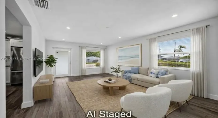 Recessed lighting, wood-finish flooring, white walls, and white window blinds