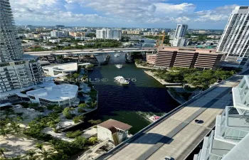 High-rise perspective featuring an urban cityscape with waterway access and multi-story high-rise architecture