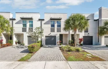 Modern townhome exterior featuring clean lines and a neutral color palette