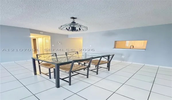 Ceramic tile flooring, geometric metal-framed overhead lighting, and an interior pass-through window with a ledge