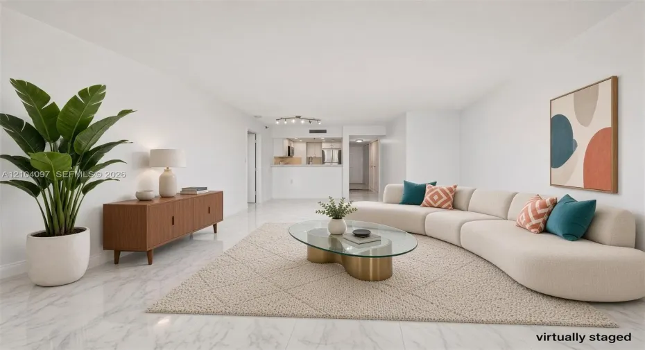 Open-concept living area featuring light-toned stone-pattern flooring, neutral wall finishes, and a breakfast bar