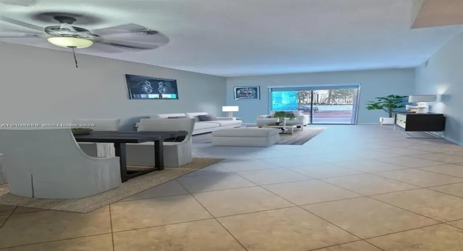 Open-concept living space featuring large-format tile flooring, a mounted ceiling fan with integrated lighting, and a floor-to-ceiling glass sliding door