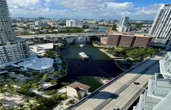 High-rise perspective featuring an urban cityscape with waterway access and multi-story high-rise architecture